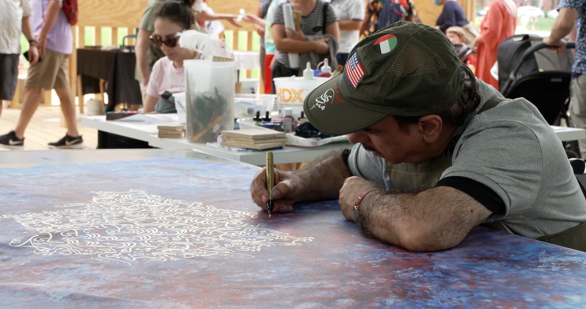 Mohammed Mandi writing calligraphy