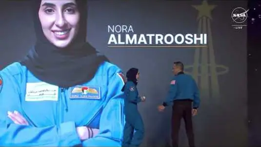 Astronaut Nora AlMatrooshi receiving the NASA astronaut pin during her graduation from the NASA Astronaut Candidate Class.
