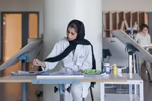 Student painting at NYU Abu Dhabi