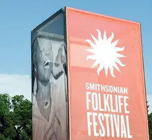 Smithsonian Folklife Festival banner on the side of a building