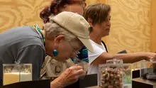 Woman smelling perfume at Smithsonian Folklife Festival